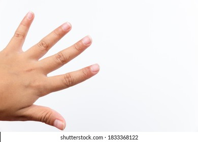 Dirty fingernails of child hand. Dirty long nails have germs make sick isolated on white background.