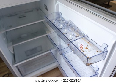 Dirty Fridge With Open Door.