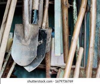 Dirty Garden Work Tools Shovels Soiled In The Ground In Vintage 