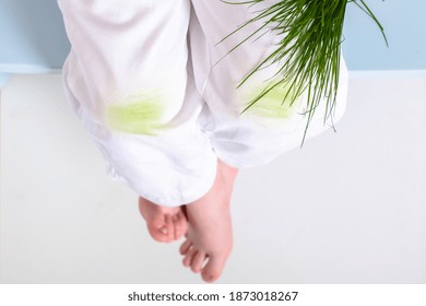 Dirty Grass Stains On Children's Pants. Daily Life Dirty Stain For Wash And Clean Concept