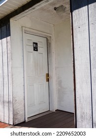 Dirty Grungy Men's Room Door