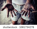 Dirty hands of children from construction work. World Day Against Child Labour concept.