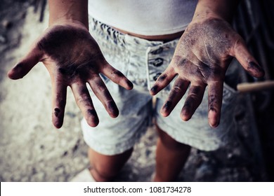 Dirty Hands Of Children From Construction Work. World Day Against Child Labour Concept.