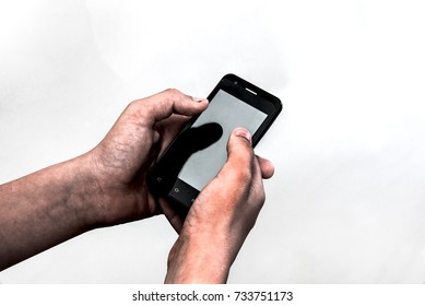 Dirty hands holding a smartphone.Concept for cheapness and poverty. - Powered by Shutterstock