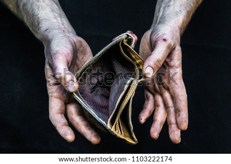 Dirty hands homeless poor man with empty wallet in modern capitalism society. Economic recession, unemployment, poverty, hunger, retirement, global crisis, inequality problem concept. 