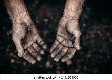 Dirty hands of worker miner are corns palms in abrasions. Concept hard work.