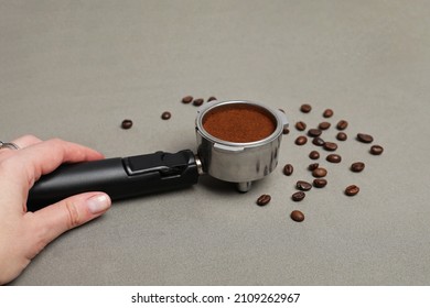 Dirty Horn From A Coffee Maker With Ground Coffee On A Gray Back