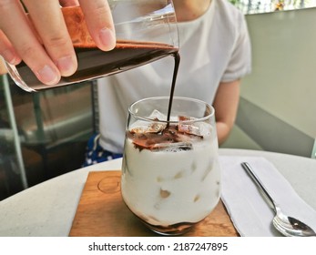 Dirty Iced Latte Pouring Espresso Shot To White Full Cream Cow Milk In Cozy Coffee Shop