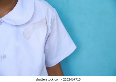 Dirty Juicy Fruit Drink Stain On Kid Shirt From Accident In Playing In Life Activity. Dirty Stain For Cleaning Concept.