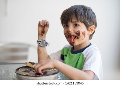 Dirty Kid Eating Chocolate Pie