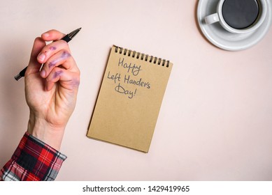 Dirty left hand after writing. Left hander day concept. Working place of lefty - Shutterstock ID 1429419965