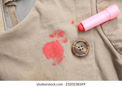 Dirty lipstck stain on cloth from using in daily life. stain for cleaning concept idea. - Shutterstock ID 2320238349