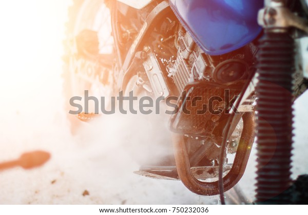 dirty\
motorcycle engine in oil lubrication. cylinder\
Detail on a modern\
and dirty motorcycle engine with oil\
fugues