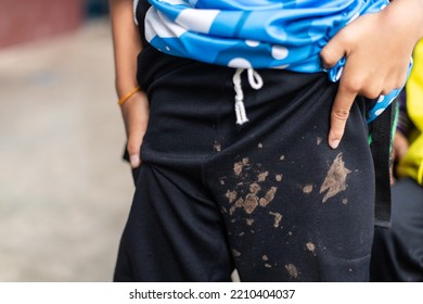 Dirty Mud Stain On Kid Pants From Long Playing In Daily Life Activity. Dirty Stain For Cleaning Concept.