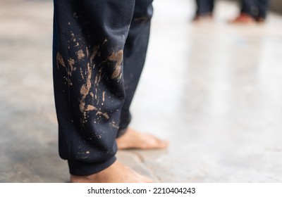 Dirty Mud Stain On Kid Pants From Long Playing In Daily Life Activity. Dirty Stain For Cleaning Concept.