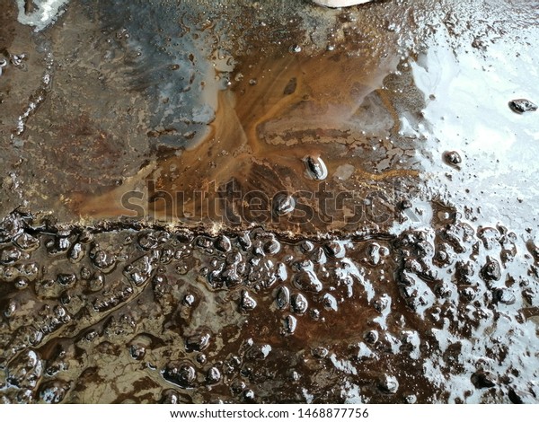 Dirty Oil spill on\
floor