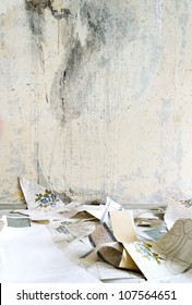 Dirty Old Room With Torn Wallpaper On The Floor. Grunge Vintage Interior