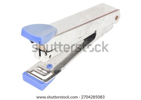 Dirty old stapler on white background.