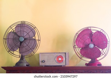 Dirty old vintage fan in retro style on the table