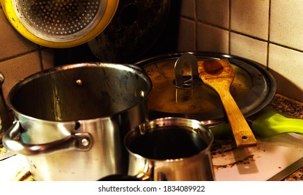 Dirty Pans And Pots In Messy Kitchen Waiting To Washing. Decay Concept.