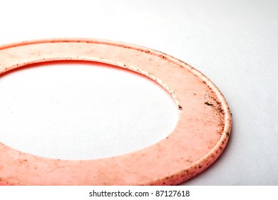 Dirty Pink Dog Frisbee Against Faded White Background