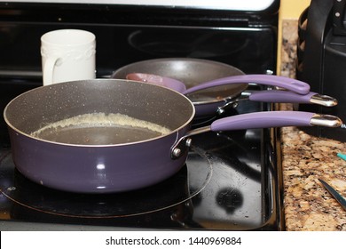 Dirty Purple Skillet On Stove Top