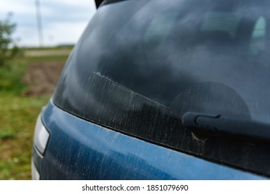 Dirty Rear Window Of The Car.