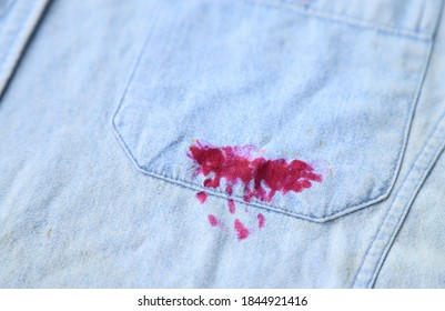 Dirty Red Ink Stain From Pen On Jean Shirt For Cleaning Concept Of Stains In Daily Life 