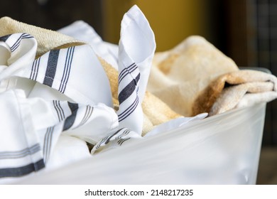 Dirty Restaurant Linens In A Bin Waiting To Be Washed By A Commercial Laundry