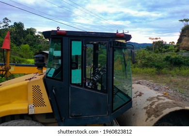 A Dirty Roadroller And Grader Parked 