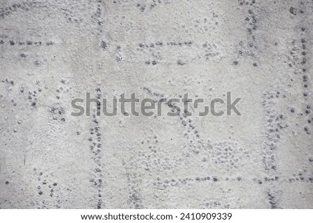 Dirty rough surface texture of sand screed cement, old gray concrete wall for background with uneven stains and tiny holes. Background image for your creative design or illustrations.