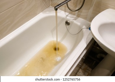 dirty, rusty water flows from the tap, unfit for drinking, water pipes