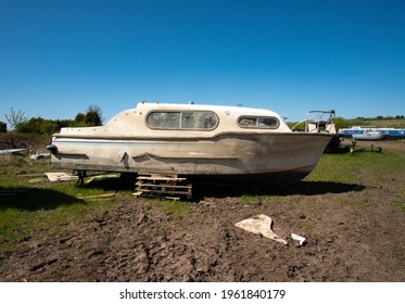 Dirty salvaged boat on dry land - Shutterstock ID 1961840179