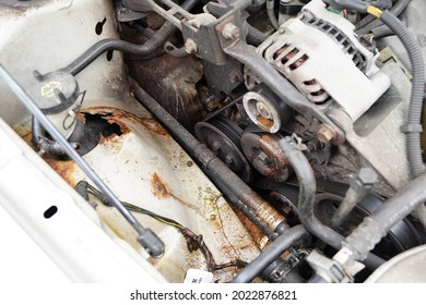 Dirty Serpentine Belt, Axels And, Pulleys In A Older Car. 