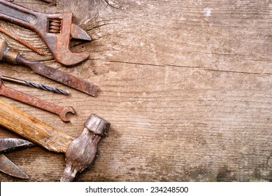 Dirty set of hand tools on a wooden background .  vintage photo - Powered by Shutterstock