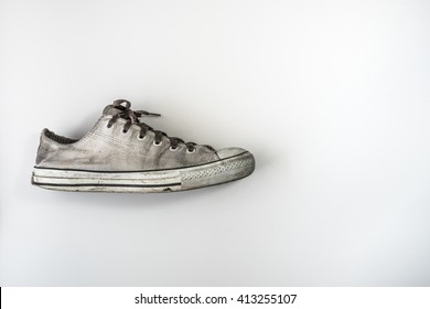 Dirty Shoes Side View On White Background