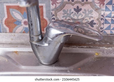 Dirty Sink In Kitchen. Plaque From Hard Water On Faucet