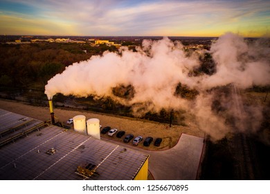 Dirty Smog Pollution Cloud Rising Up And Spreading Across The Landscape And Sky Sunrise Aerial Drone View Of Climate Change Smoke Stack Asthma Cancer Casing Dangerous Smog     