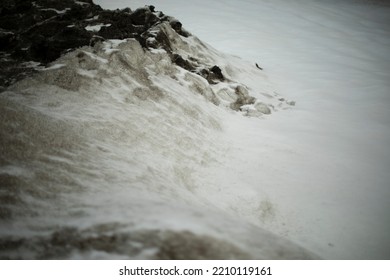 Dirty Snow By Road. Side Of Road In Winter. Blocks Of Ice Are Black. Snow Dump.