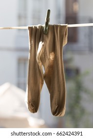 Dirty Socks Hanging On A Rope