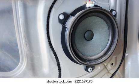 Dirty Speakers In The Car Door. Closeup Of Old And Dirty Dusty Speakers Installed On Car Door In Garage With Copy Space. Selective Focus