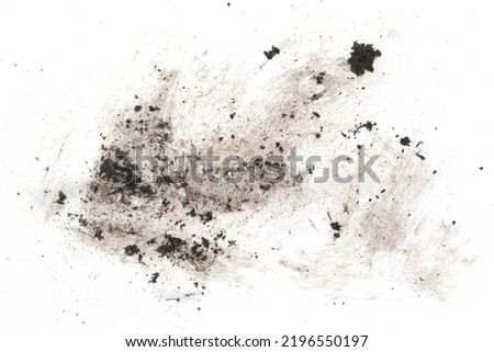 Dirty spots of earth on a white background. The paper is dirty.
