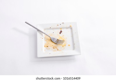 Dirty square plate with a fork