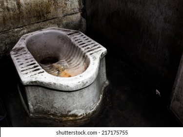Dirty squat type toilet