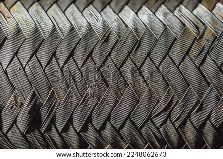 the dirty surface is a pattern with interlaced briny metal wires of silver color; used car part