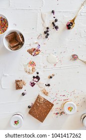 Dirty Table After Cooking And Eating Ice Cream: Drops, Sprinkles, Berries. The Concept Of Mess, Dirty Dishes.