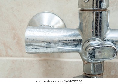 Dirty Tap Faucet In The Bathroom In The Plaque And Stains From The Water.