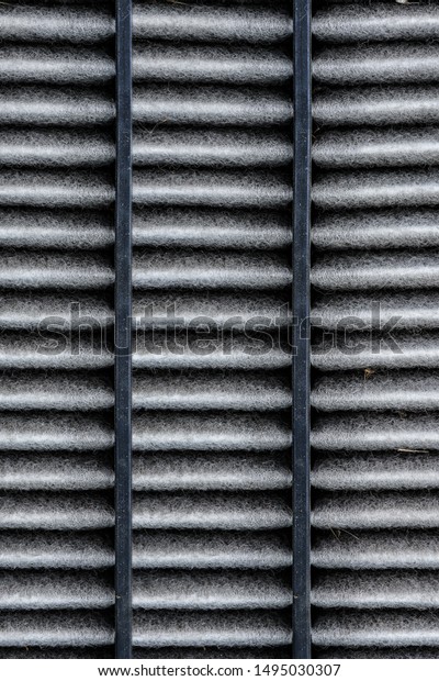 dirty texture of air filter for car, automotive\
spare part in plastic case isolated on white background with\
clipping path