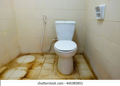 Dirty toilet in a house.