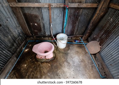 Dirty toilet in a metal shed